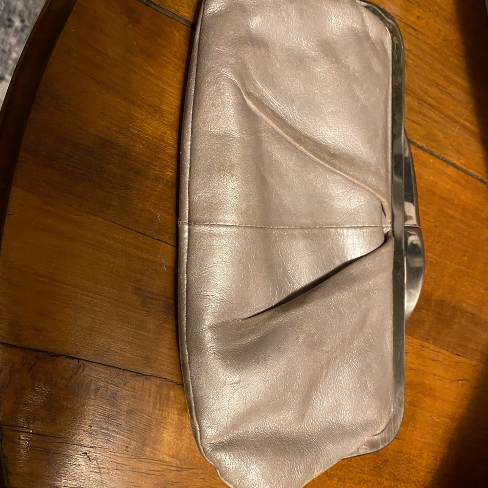 Hobo handbag. Iridescent cream with silver hardware. Perfect condition.